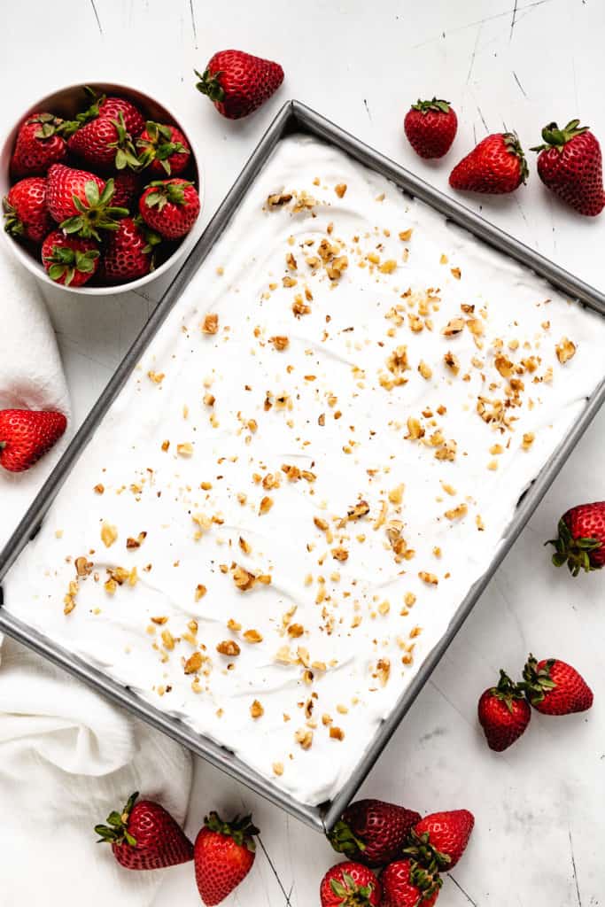 Top down view of strawberry jello dessert.