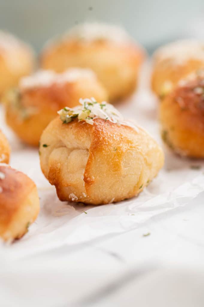 Side view of a baked garlic knot.
