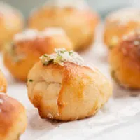 Air fry garlic knot on a table.