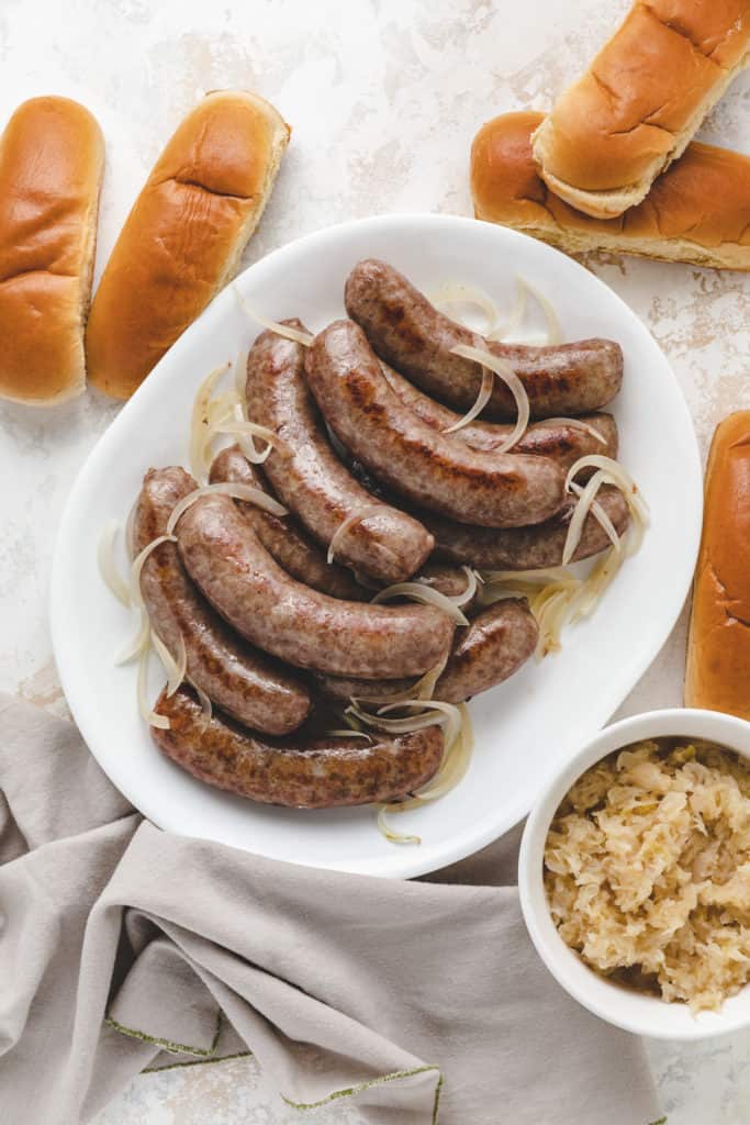 Top down view of brats on a platter.