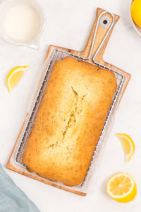 Lemon poppy seed bread on a cooling rack.