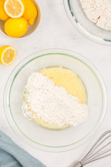 Flour poured on top of eggs and mixture.