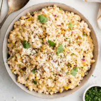 Top down view of mexican street corn pasta salad in a serving dish.