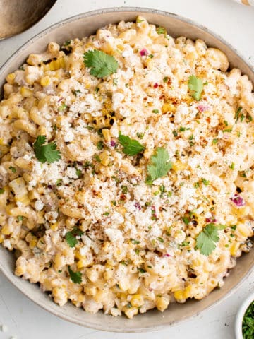 Top down view of Mexican street corn pasta salad in a serving dish.