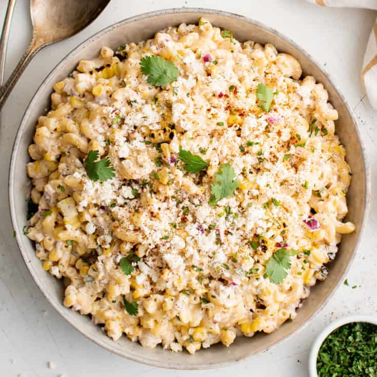 Top down view of Mexican street corn pasta salad in a serving dish.