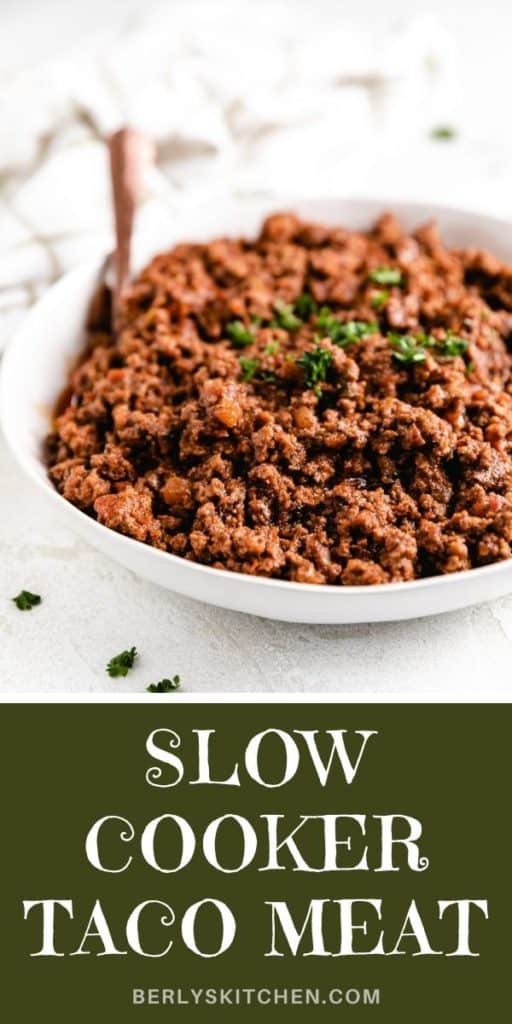 Side view of a serving dish of slow cooker taco meat.