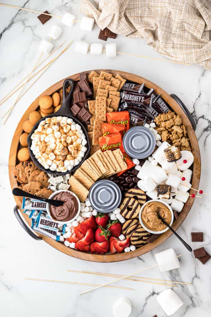 Snack board with candy, chocolate and crackers.