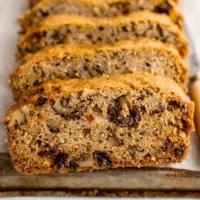 Sliced zucchini bread on a pan.