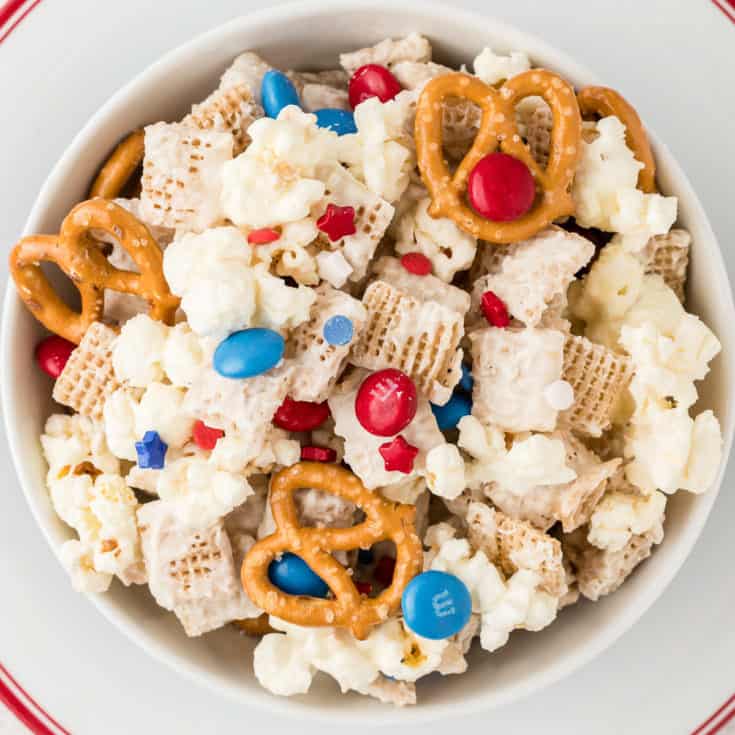 Top down view of a bowl of festive snack mix.