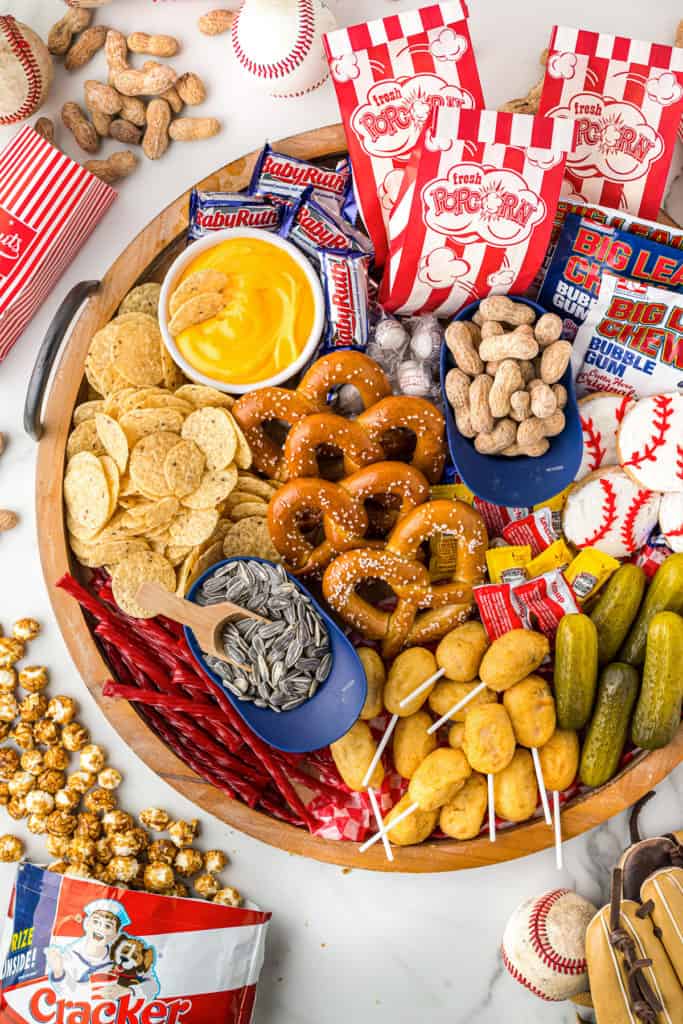 Top down view of a board filled with snacks.