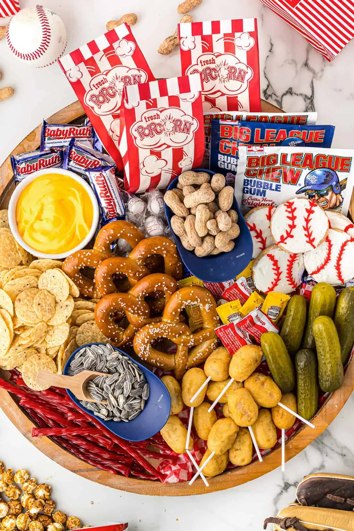 Pretzels and snacks on a wooden board.