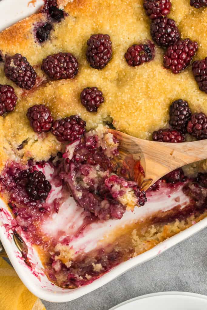 Spatula scooping cobbler out of a pan.