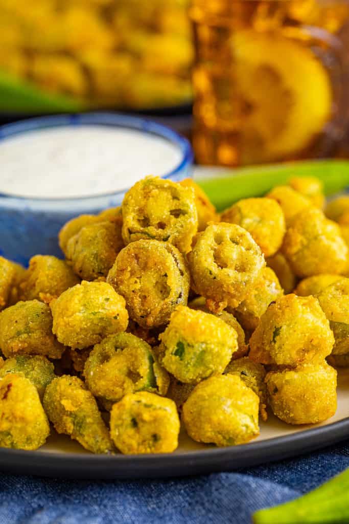 Close up view of battered okra on a plate.