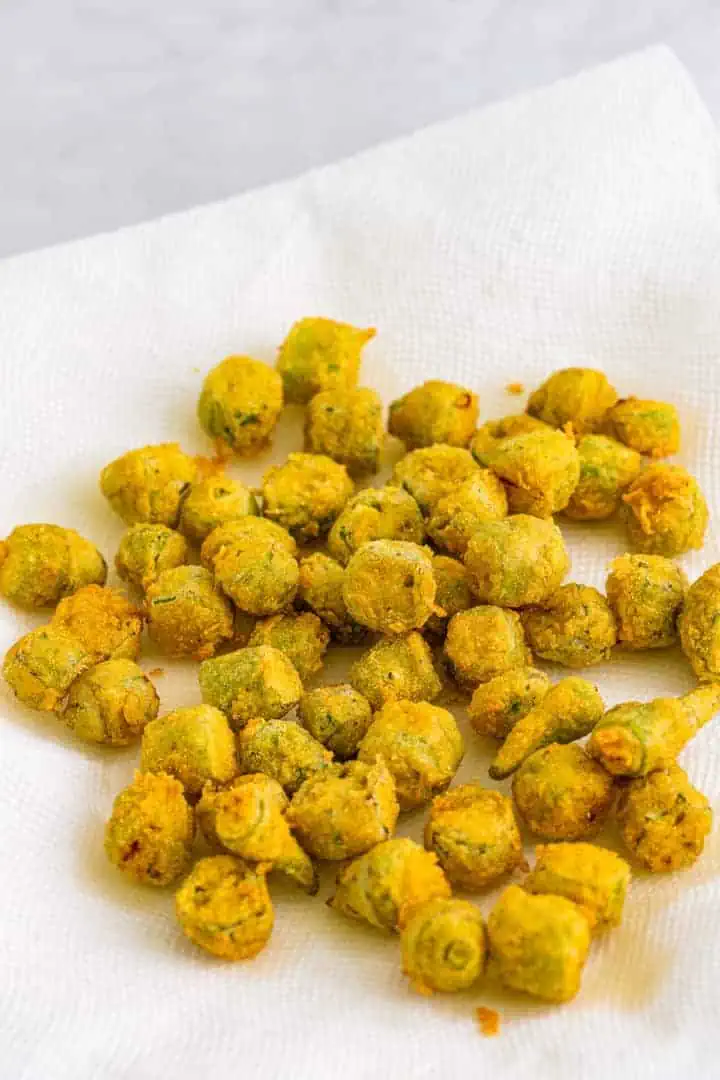 Fried okra on paper towels.