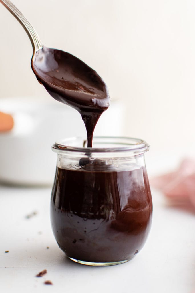 Hot fudge sauce on a spoon.