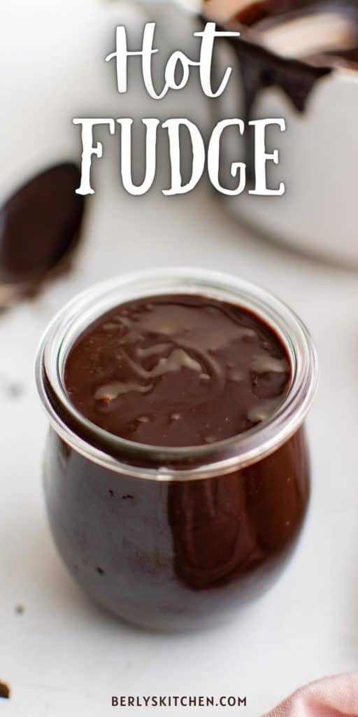 Close up view of hot fudge sauce in a jar.