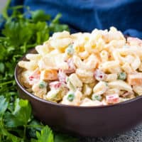 Close up view of creamy pasta salad in a bowl.