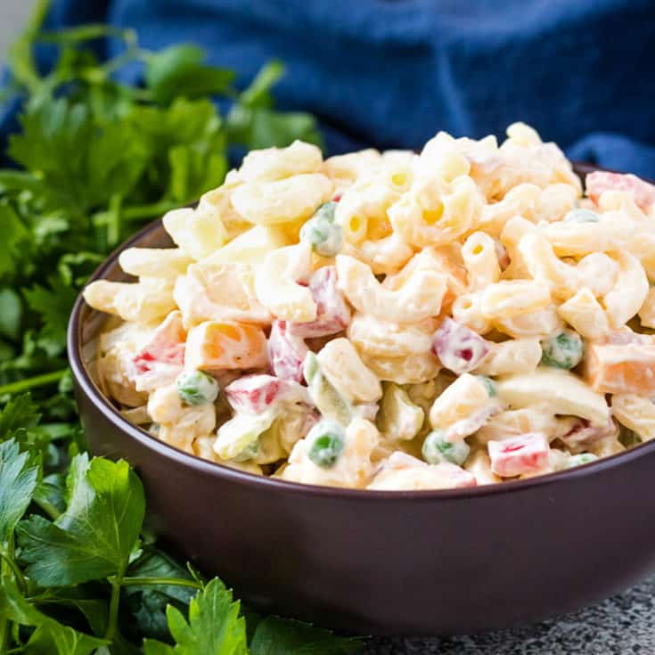 Close up view of creamy pasta salad in a bowl.