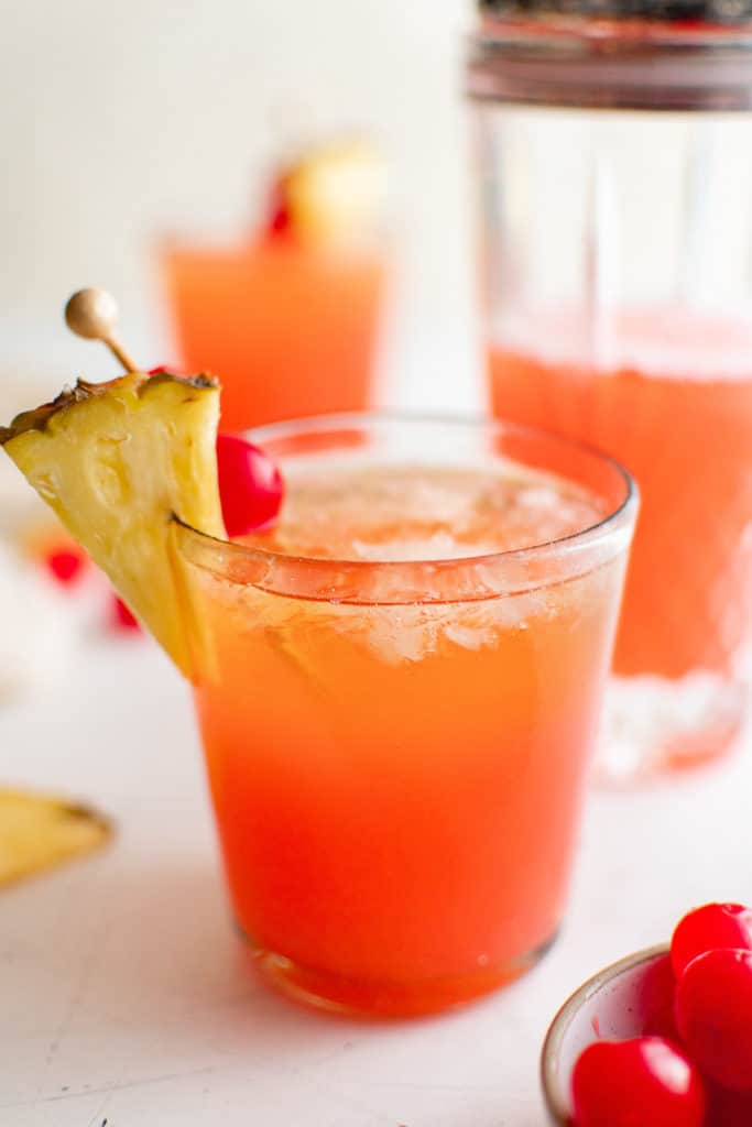 Tropical cocktail with pineapple and cherry.