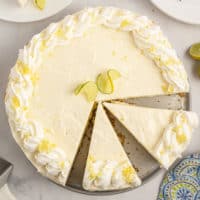 Top down view of a sliced key lime cheesecake.