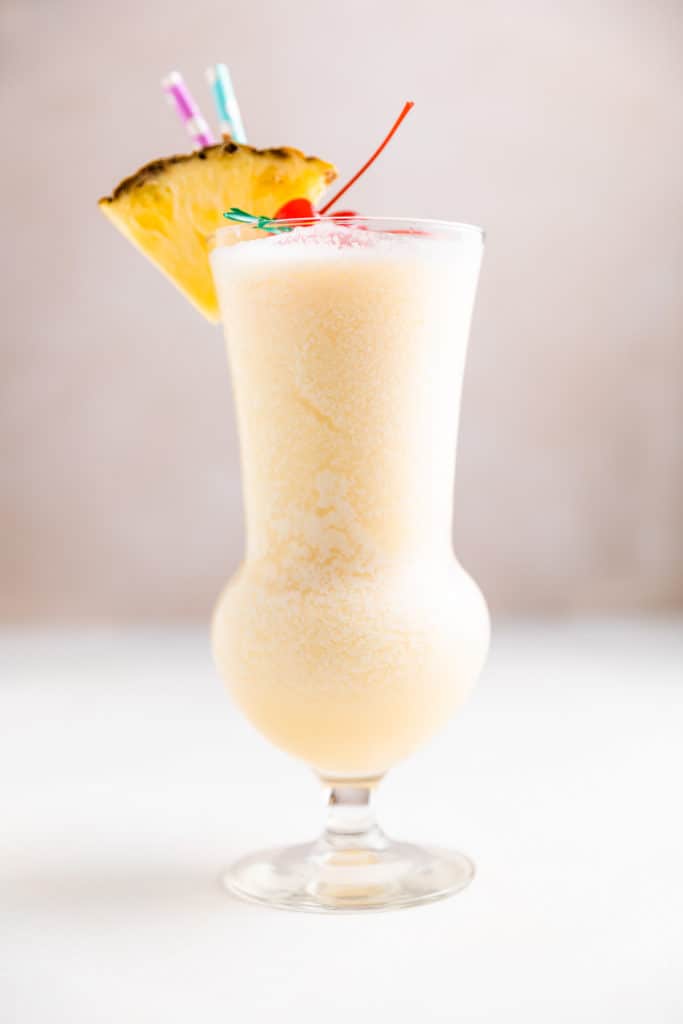 Side view of a pineapple coconut cocktail.