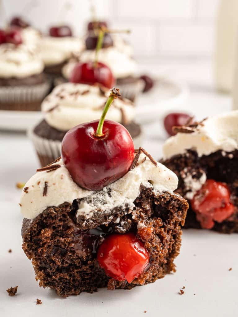 Chocolate cherry cupcake cut in half.