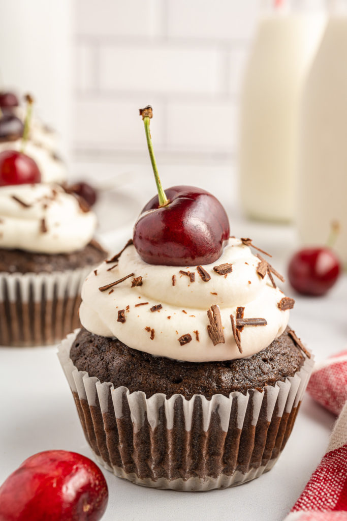 Chocolate cupcake with a cherry on top.
