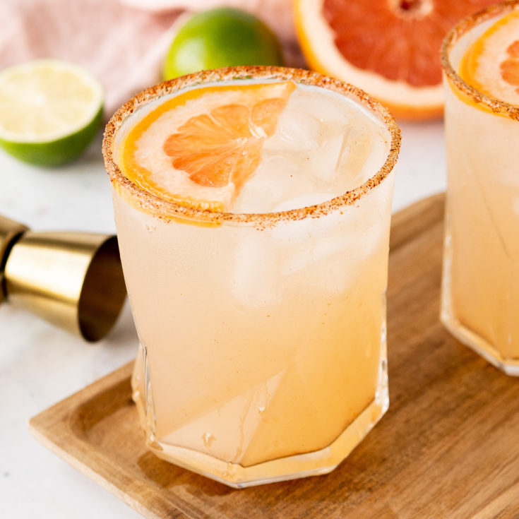 Glass filled with grapefruit flavored mezcalita cocktail.
