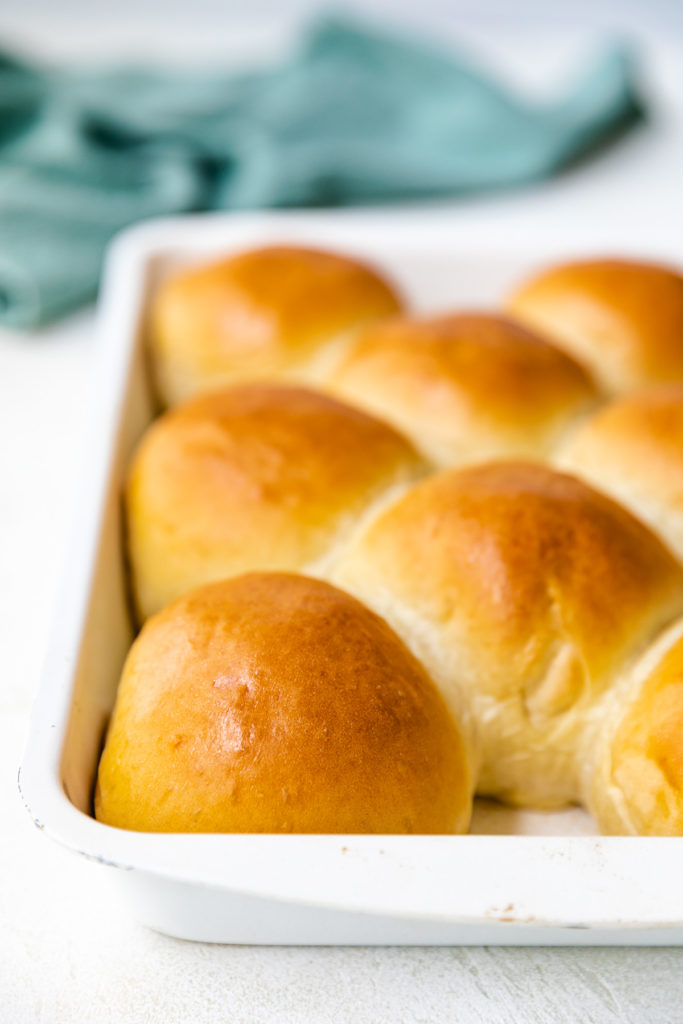 Baking pan filled with brioche rolls.