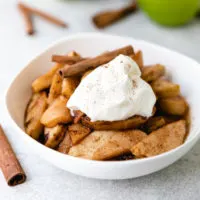 Bowl of cooked cinnamon apples.