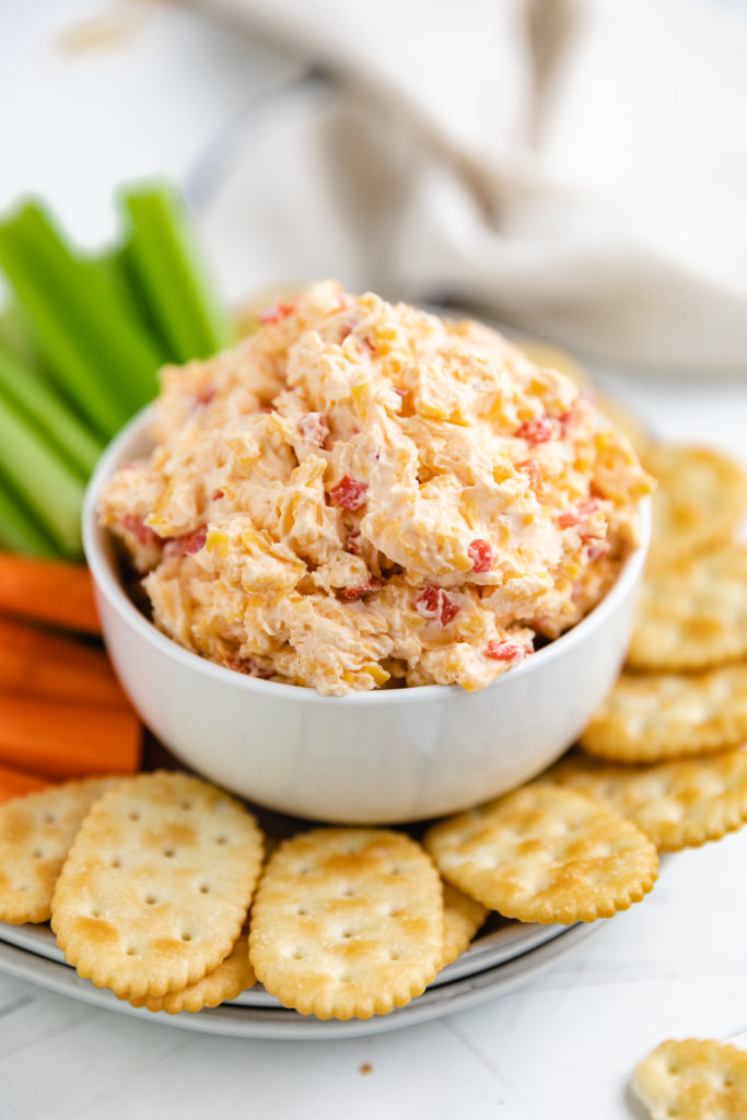 White dish filled with pimento cheese.