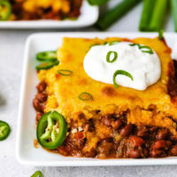 Side view of a slice of chili cornbread casserole.