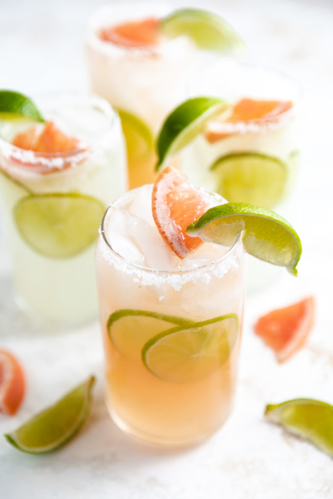 Grapefruit and lime slices on a cocktail.