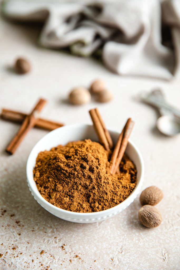 Cinnamon sticks in a bowl of spice blend.