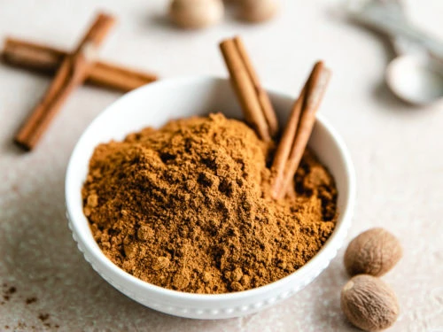 White bowl holding a spice blend.