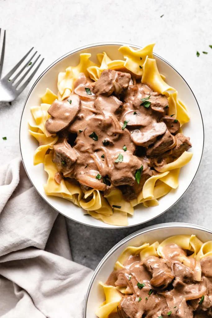 Plates of beef stroganoff.