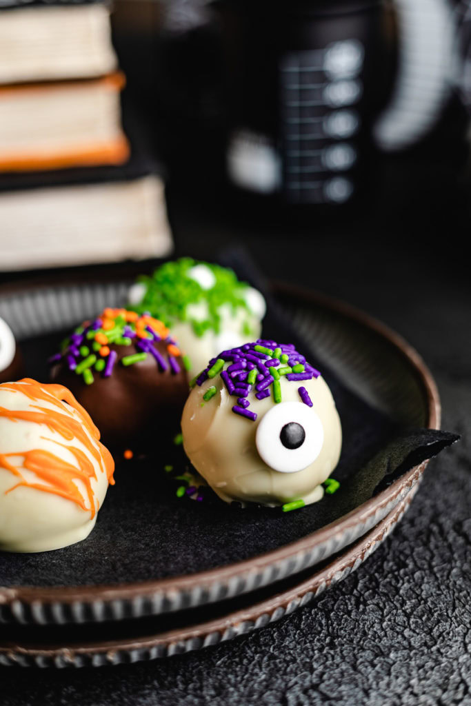 Monster truffles on dark plates.