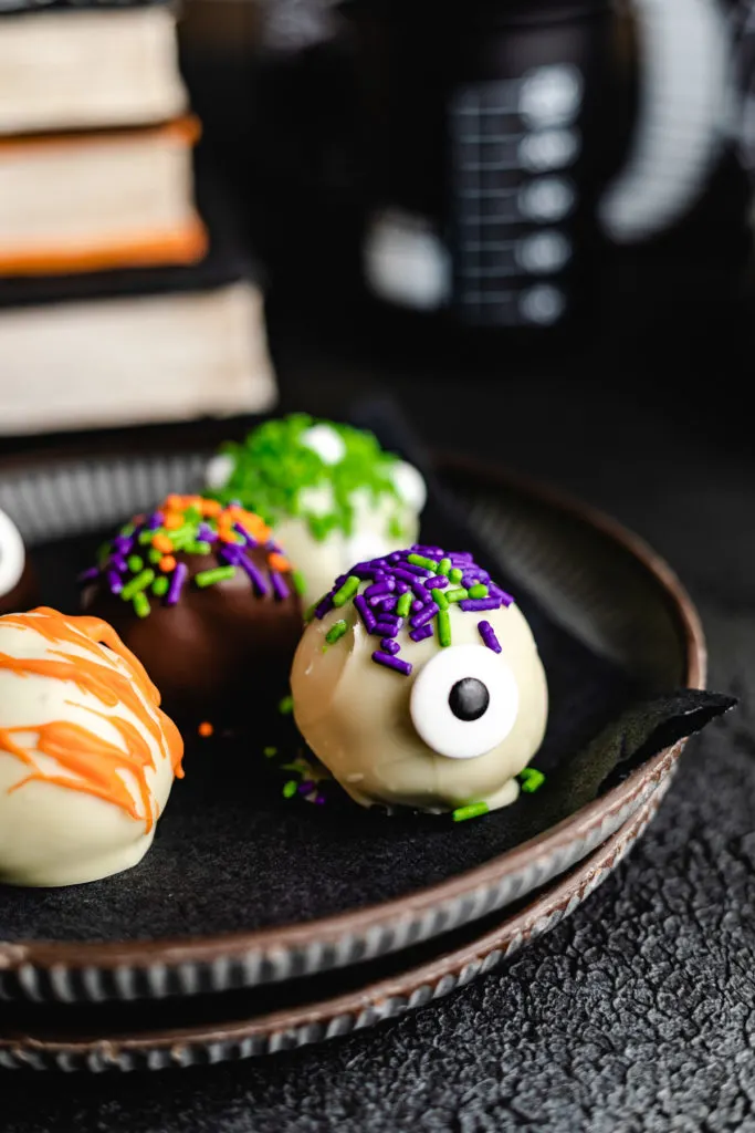 Monster truffles on dark plates.