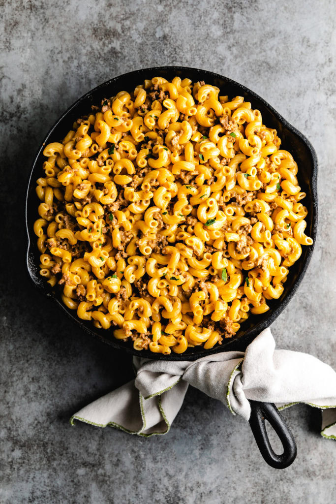 Cast iron pan of hamburger helper.