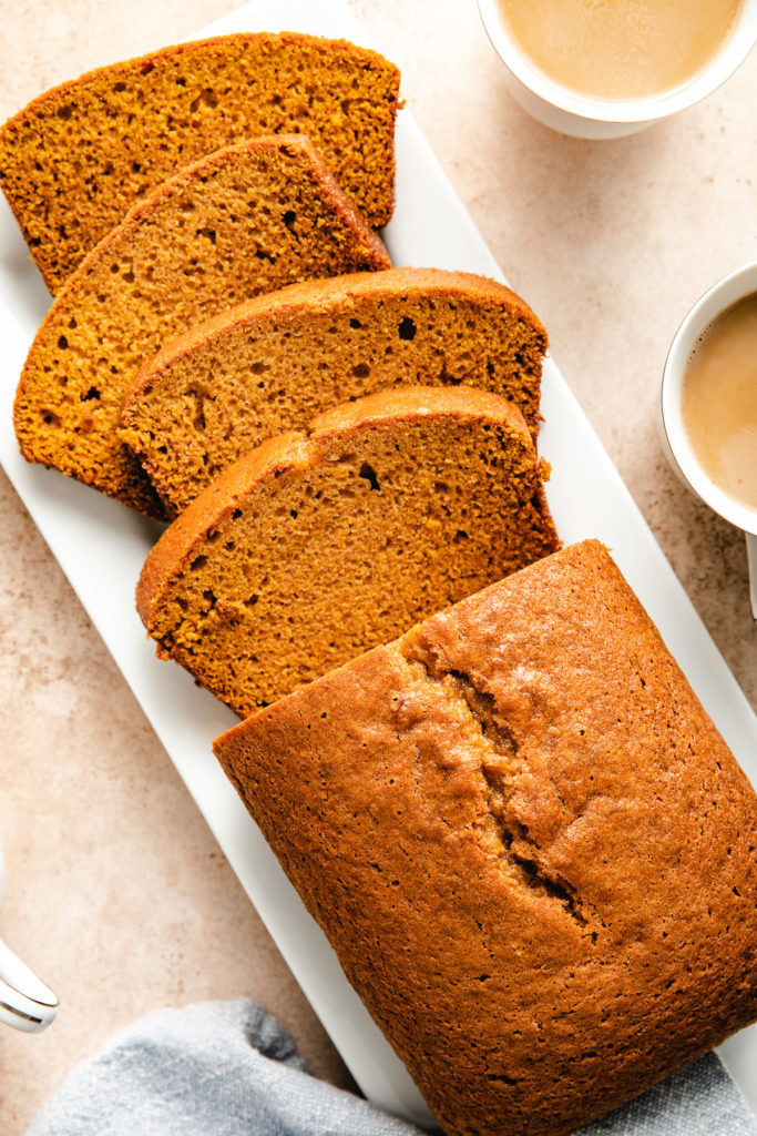 Sliced pumpkin bread on a platter.