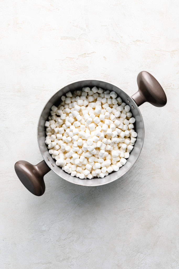 Mini marshmallows and melted butter in a pan.