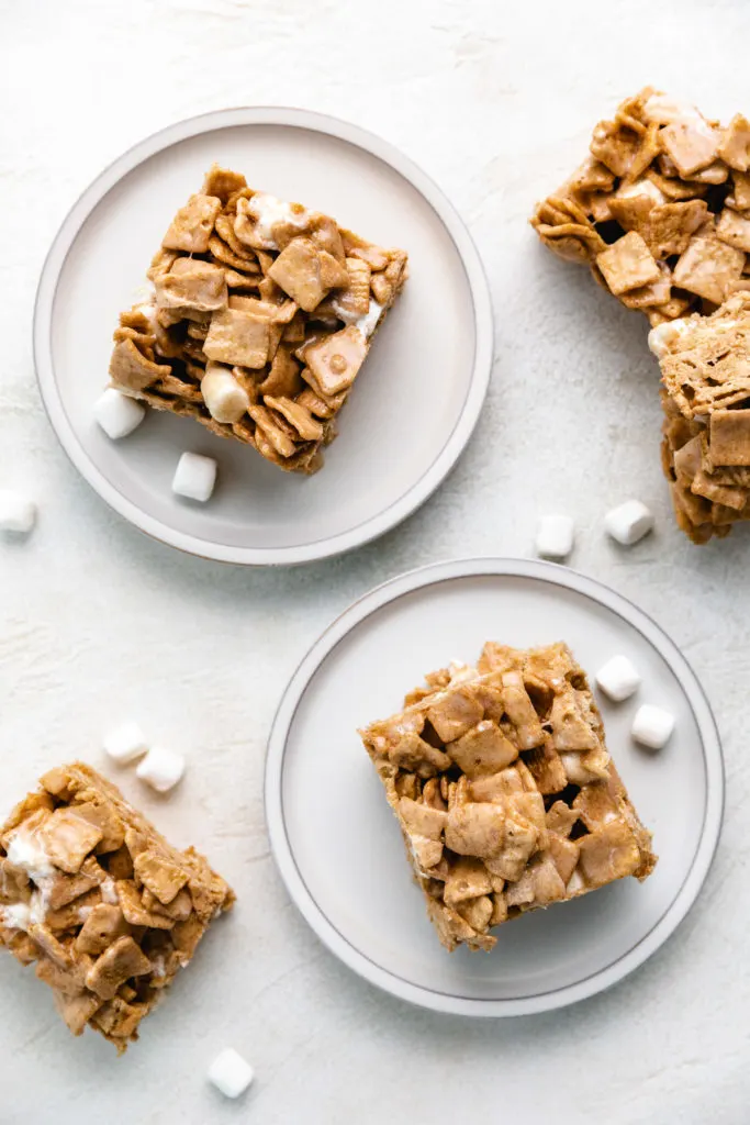 Top down view of cinnamon marshmallow bars on plates.