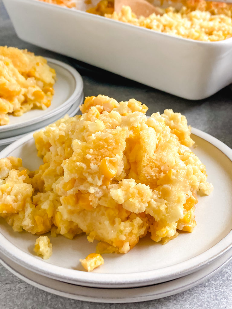 Side view of casserole with cornbread on a plate.