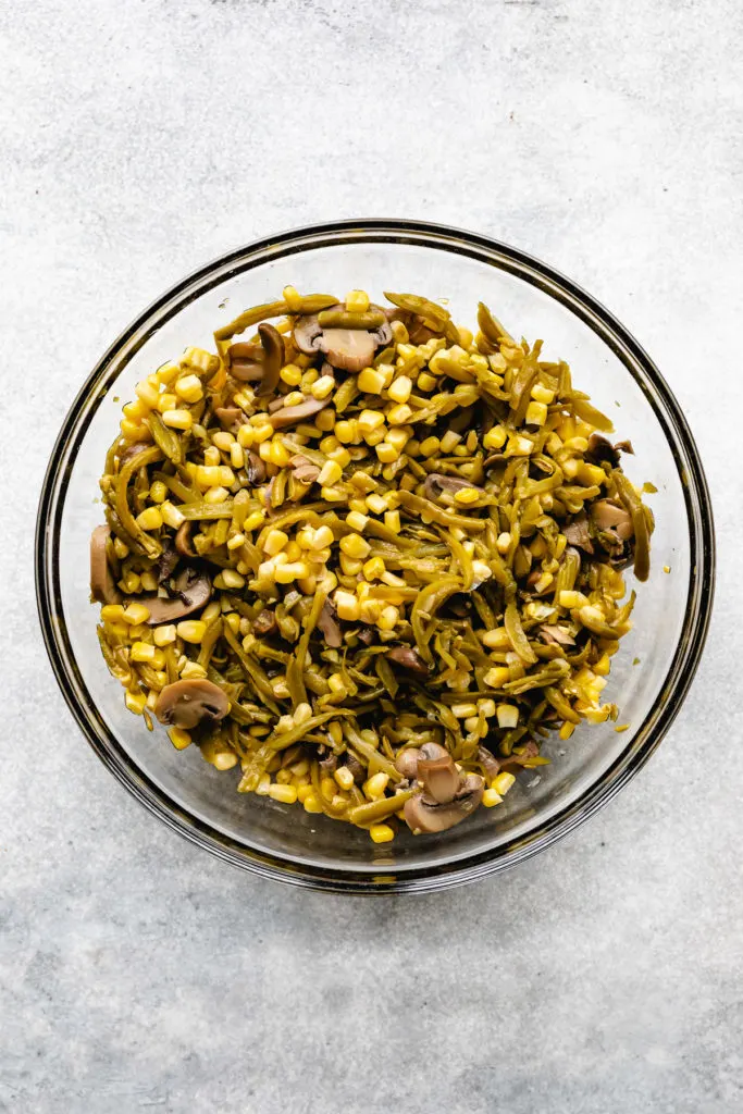 Green beans, corn and mushrooms in a bowl.