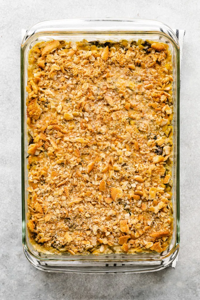 Casserole in a pan with crackers on top.
