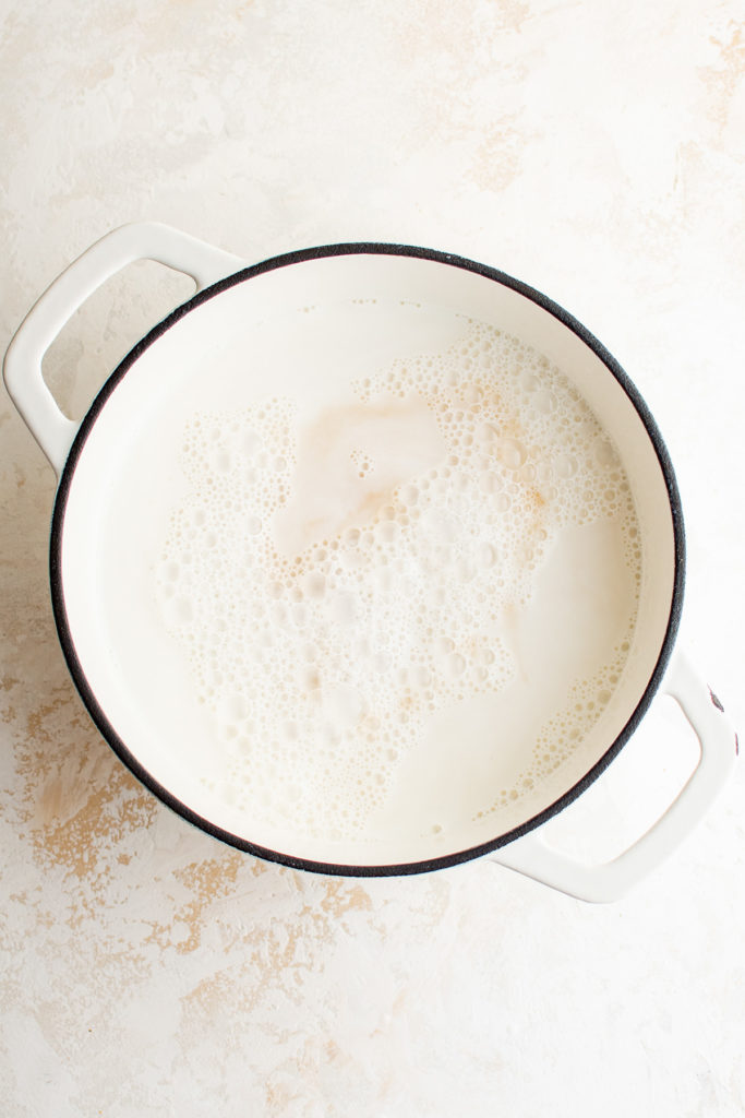 Milk and vanilla in a pan.