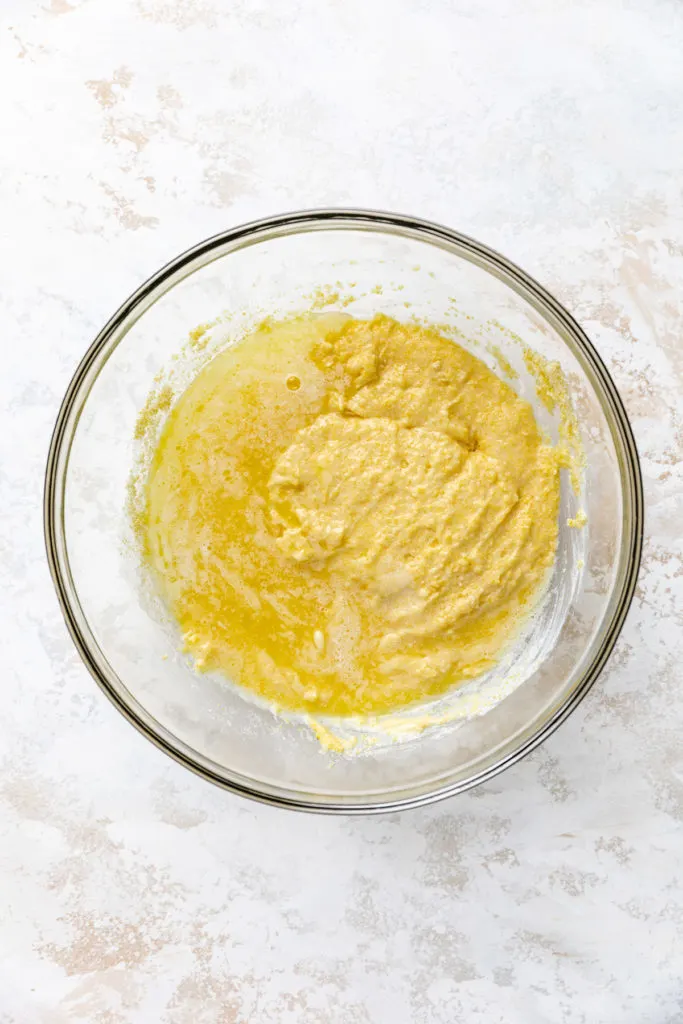 Cornbread mix with melted butter poured on top.
