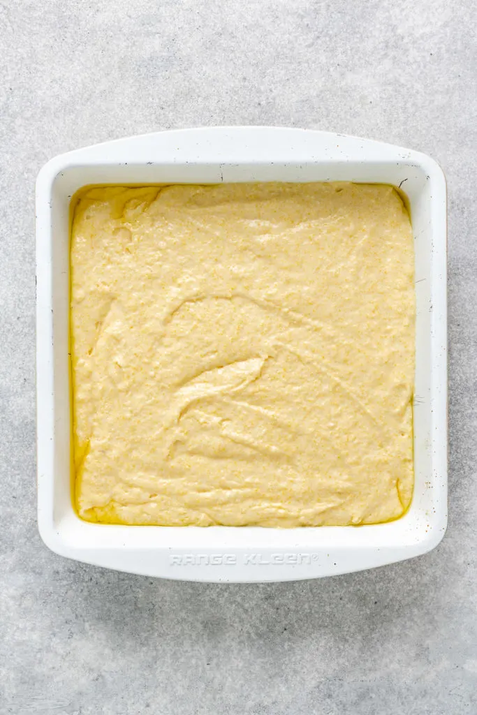 Unbaked cornmeal batter in a pan.