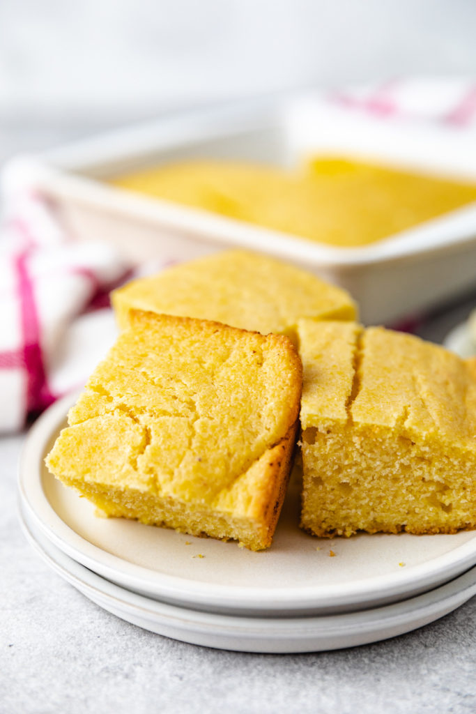 Slices of freshly baked cornbread on a plate.