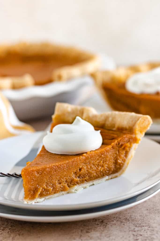 Slice of thanksgiving pie on a plate.